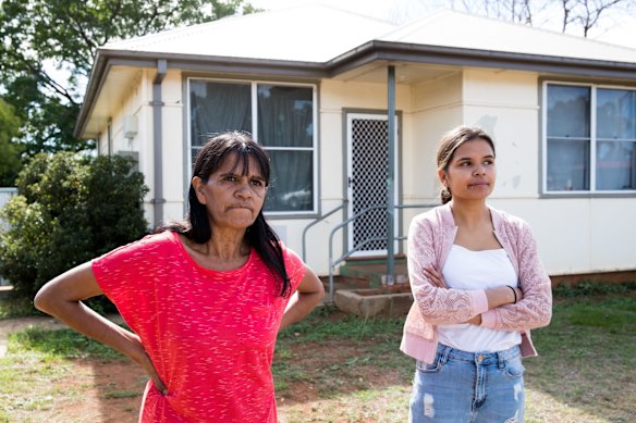 Lee-Anne Ebsworth with her daughter, Chyanne Ebsworth, outside the public housing home of her mother in Dubbo. Her family lived in the Gordon Estate during the 2006 riots and were forced to move afterwards when the government bulldozed dozens of homes and sold others. Since then her family is scattered over Dubbo, and  Lee-Anne remains homeless after being denied another public housing home. She spends her time staying with relatives.
