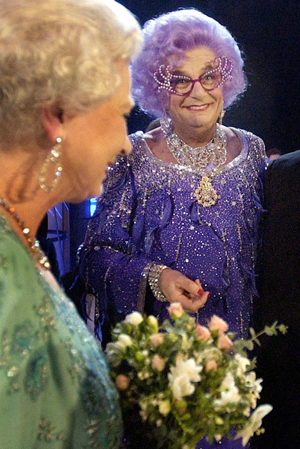 Britain's Queen Elizabeth II, left, meets Barry Humphries aka Dame Edna Everage, at the Festival Theatre in Edinburgh for the start of the 75th Royal Variety performance, Monday Nov. 24, 2003.