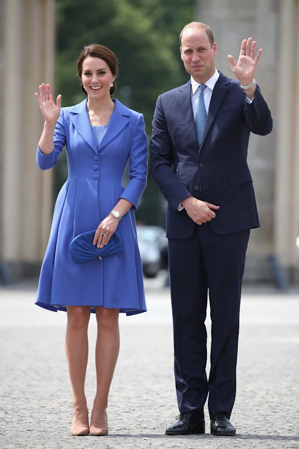 The Duchess wore a scalloped shift dress and Gianvito Rossi 105 suede heels to accompany the coat.