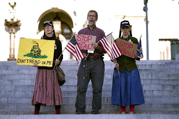 People demonstrate outside the Pennsylvania State Capitol in Harrisburg.
