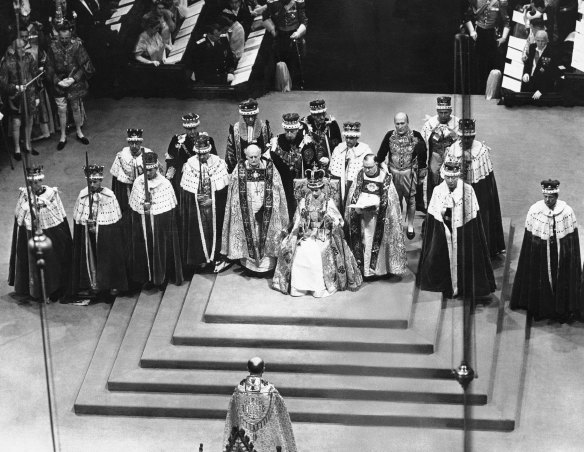Surrounded by peers and churchmen, Queen Elizabeth II sits on throne in Westminister Abbey, London, June 2, 1953 after her coronation. 