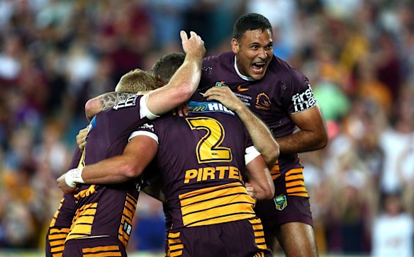 Broncos player Justin Hodges celebrates the try of Corey Oates.