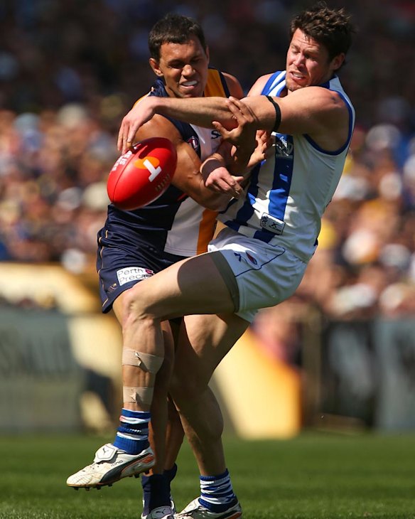 Eagle Josh Hill and Roo Sam Gibson fight for the ball.