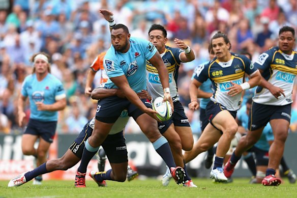  ekope Kepu of the Waratahs passes in a tackle 