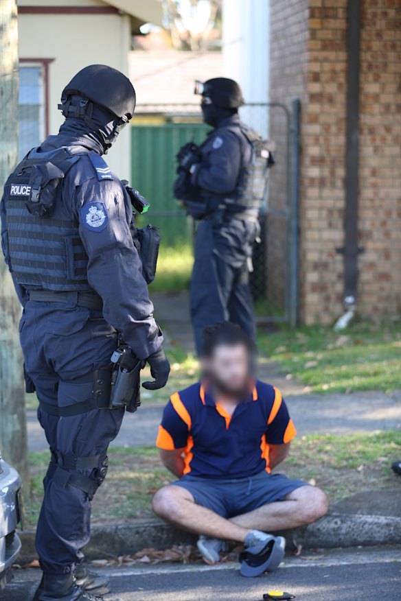 Mehmet Biber being arrested this morning in Birrong on terrorism and foreign incursion charges.