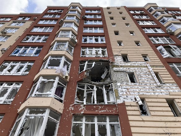 Smashed windows in a damaged apartment block in Irpin. Heartened by Russia's withdrawal from the capital region, some residents have been returning to what's left of their homes.