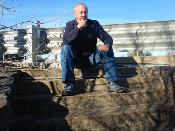 Thomas Schulze sits atop the stairs to nowhere at Malcolm Fraser Bridge.