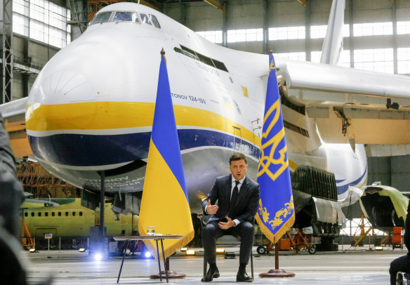 Ukrainian President Volodymyr Zelensky speaking to media during a news conference in front of the Ukrainian Antonov An-225 Mriya at the Antonov aircraft factory in Kyiv in May 2021.