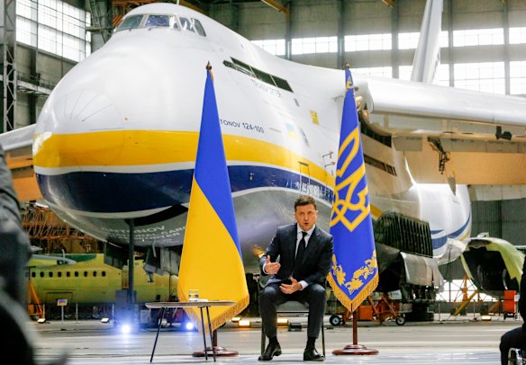 Ukrainian President Volodymyr Zelensky speaking to media during a news conference in front of the Ukrainian Antonov An-225 Mriya at the Antonov aircraft factory in Kyiv in May 2021.