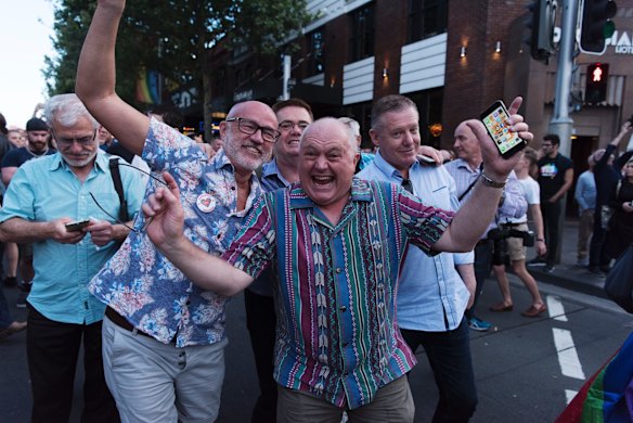 Crowds march down Oxford St, Darlinghurst this evening to celebrate the majority yes vote of the results of the postal vote.
