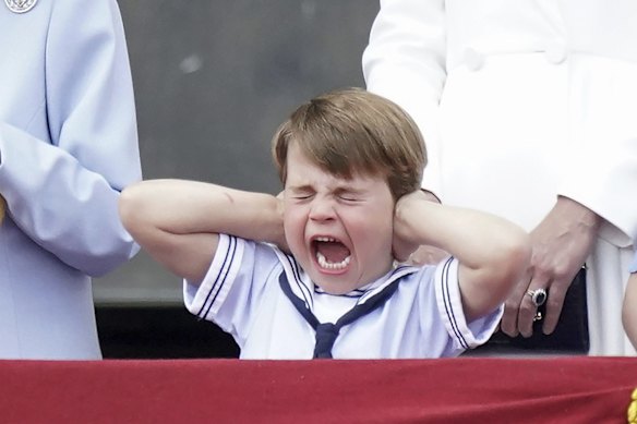 Prince Louis covers his ears as Royal Air Force planes fly over Buckingham Palace.