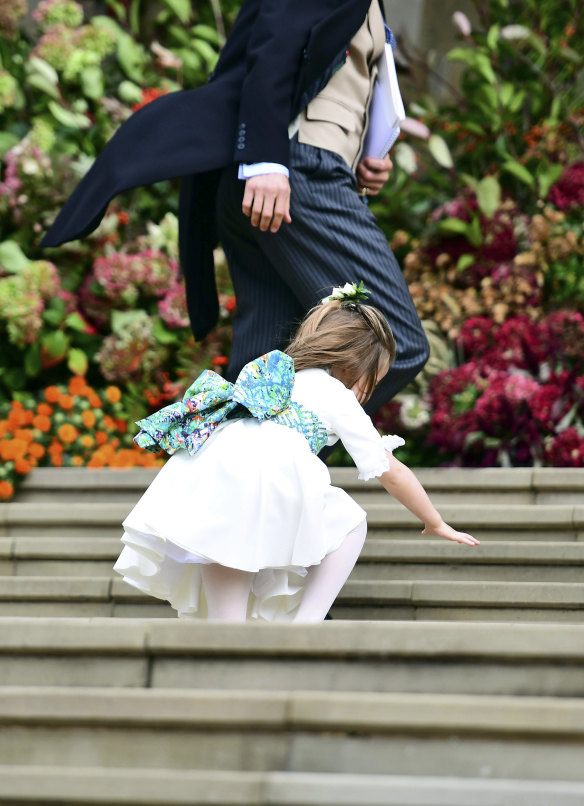 Princess Charlotte trips as she makes her way into the church.