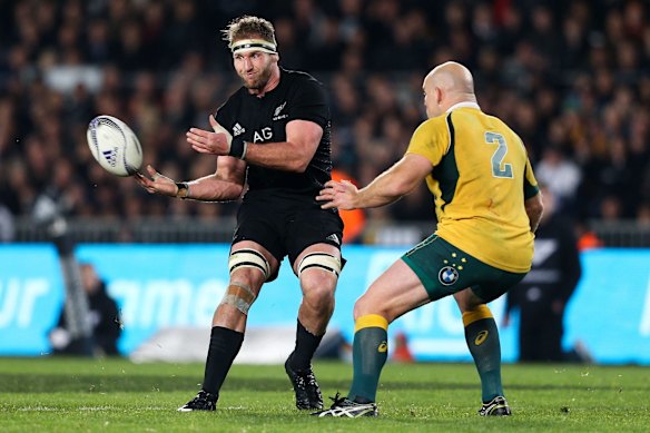 Kieran Read flicks the ball on.