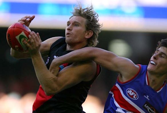 Essendon's James Hird in  marks in front of Bulldog Ryan Griifin in 2006, his second-last season.
