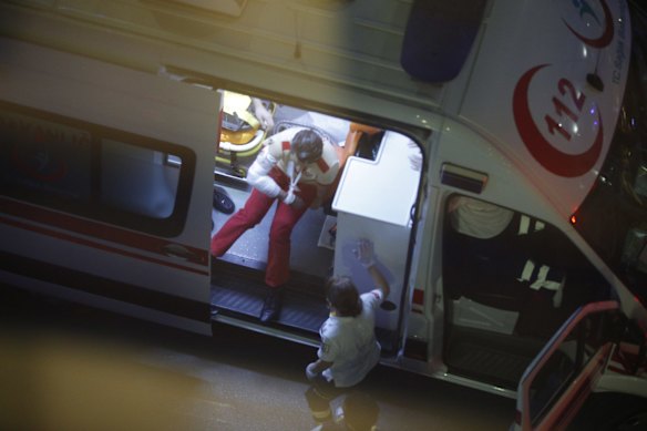 An injured person sits in an ambulance outside Istanbul's Ataturk airport.