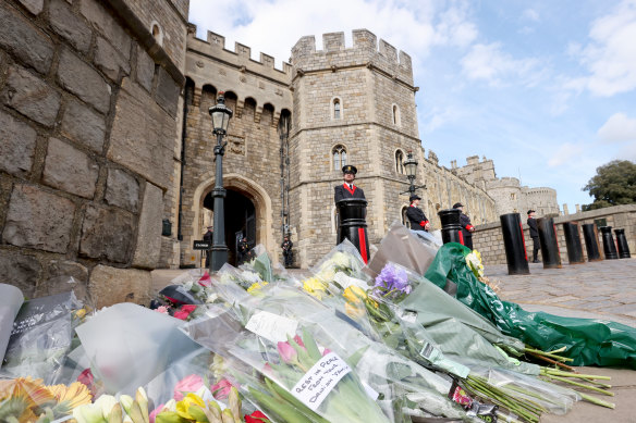 Floral tributes are left at Windsor Castle following the death of Prince Philip on Friday.