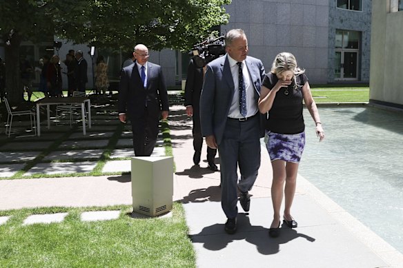 Opposition Leader Anthony Albanese and Julie-Ann Finney depart after a doorstop interview on veterans suicide, at Parliament House in Canberra..