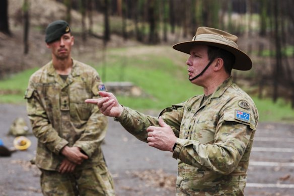 Colonel Warwick Young addresses ADF troops working at the Eurobodalla Botanic Gardens.