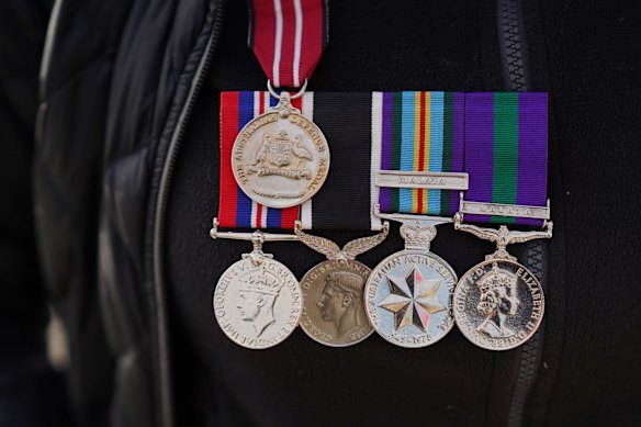 Libby Haverfield of Melbourne wears medals received by her father, who served for the New Zealand Air Force in WWII.