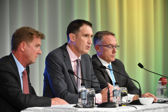 Done deal: Cricket Australia chief James Sutherland (centre) with Seven's Tim Worner and Foxtel's Patrick Delany.