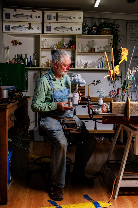 Mark Eliott, owner of Mark Eliott Glass, inside his studio after teaching a group of students to glass blow.