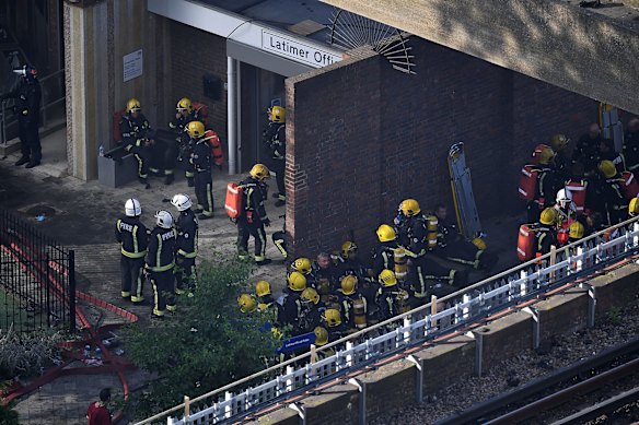 Firefighters outside Grenfell Tower in West London.