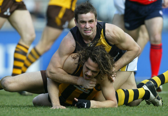 Former Richmond player Ty Zantuck tackles Hawthorn’s Mark Williams in 2004.