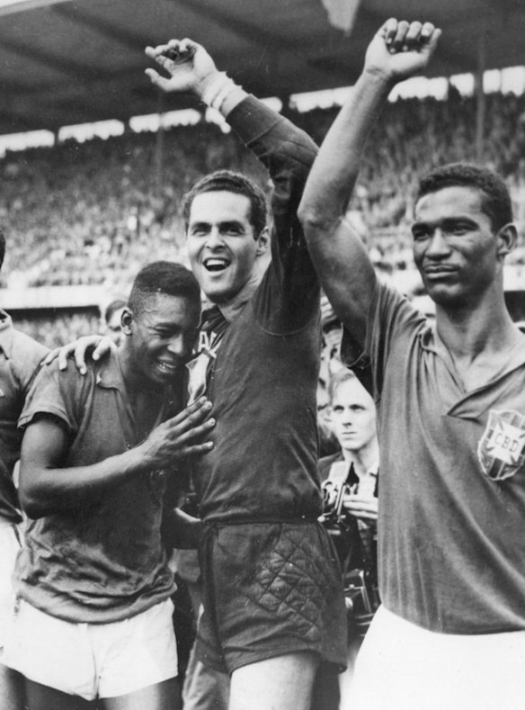 Pele, left, weeps on the shoulder of goalkeeper Gylmar Dos Santos Neves, as Didi stands right, after Brazil's 5-2 victory over Sweden in the final of the 1958 World Cup in Stockholm, Sweden.