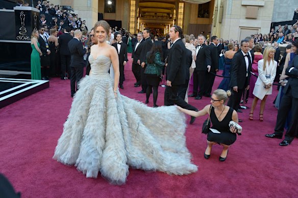 Best Supporting Actress nominee Amy Adams arrives on the red carpet for the 85th Annual Academy Awards on California.