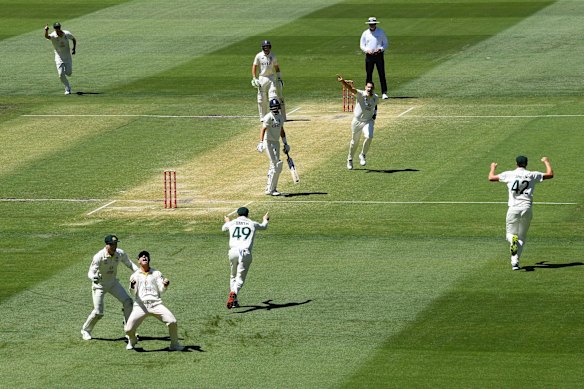 Scott Boland of Australia celebrates after dismissing Joe Root of England.