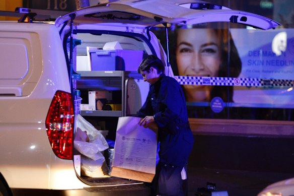 Forensic teams arrive at a building on Clarence Street on Tuesday evening to examine the scene of the murder victim.