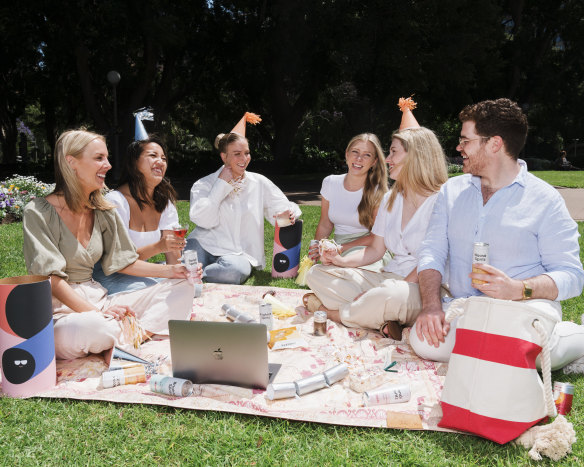 This year, PR professional Michelle Simmonds will be partying with her Melbourne colleagues remotely thanks to a "party in a box". She is pictured with, from left, Sydney co-workers Sabrina Lau, Prudence Thompson, Chloe McIntosh, Emma Crompton and Shane Sutherland.