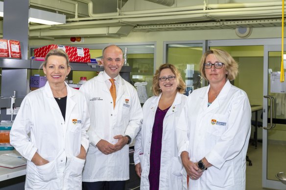 Professor Belov, with federal Environment Minister Sussan Ley (left), NSW Environment Minister Matt Kean and Professor Carolyn Hogg (right) at the university’s lab where koala genes from hundreds of animals will be examined.