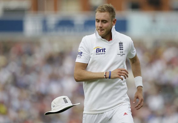 Stuart Broad throws his hat after retrieving a ball.