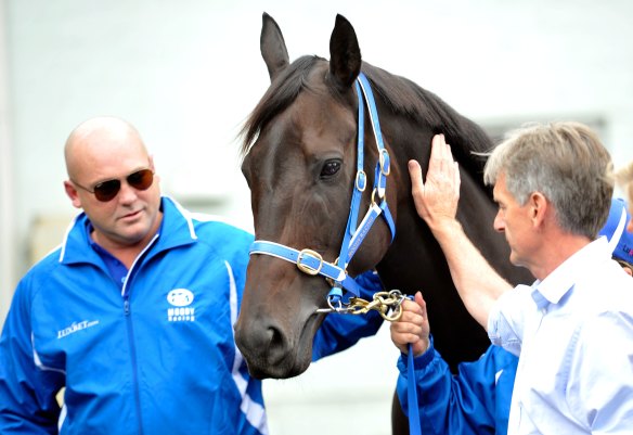 Pressure: Neil Werrett, right, and trainer Peter Moody with Black Caviar after announcing her retirement.