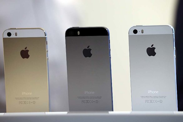 The iPhone 5S in gold, grey and silver.