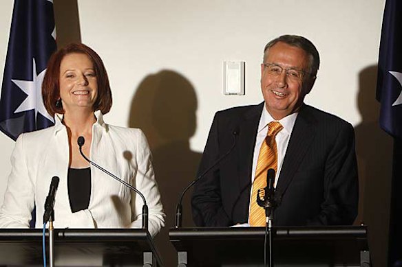 Prime Minister Julia Gillard and Treasurer Wayne Swan speaks during a press conference at Parliament House. Photo: Glen McCurtayne