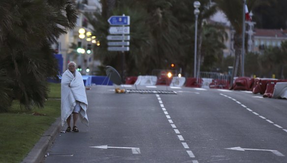 A man walks near the scene of the attack the morning afterward.  