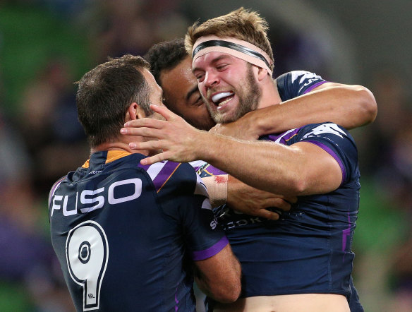 Off the mark: Melbourne forward Christian Welch celebrates his first NRL try.