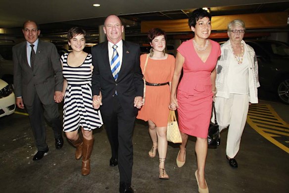 Campbell Newman arrives at the Hilton Hotel with his family.