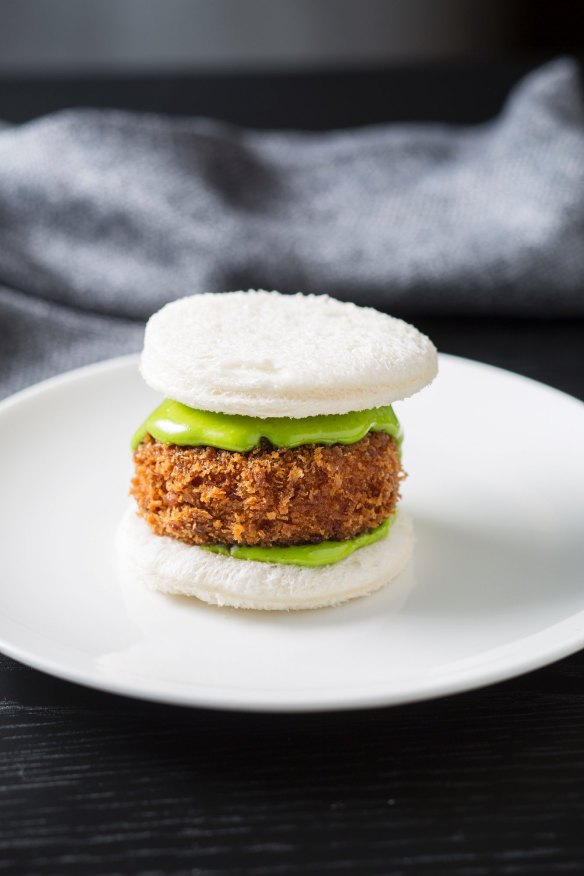 Crumbed pig's head on fluffy white bread.