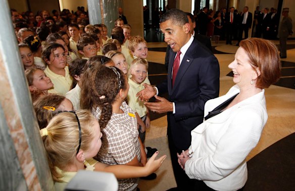 U.S. President Barack Obama and Australian Prime Minister Julia Gillard meet with gathered students at Parliament House in Canberra, Australia.