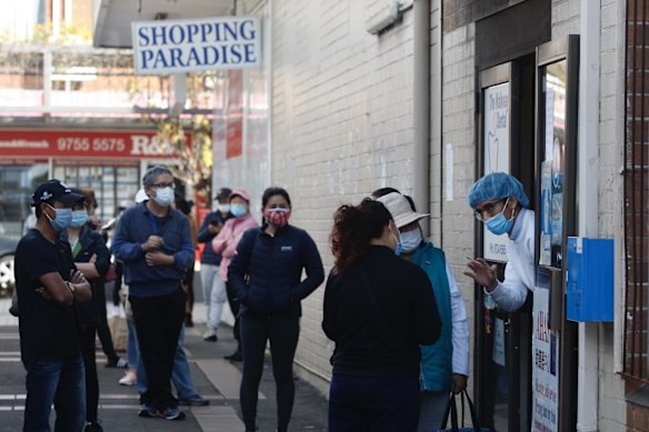 In contrast to Quin On's pharmacies offering walk-in-off-the-street AstraZeneca COVID vaccines where queues are minimal, a medical clinic 200 meters away sees lines of people awaiting Pfizer COVID vaccine shots.