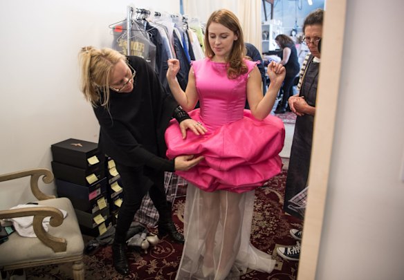 Gabriela Tylesova (left) fits a bridesmaid dress for Janine, played by Laura Murphy. 