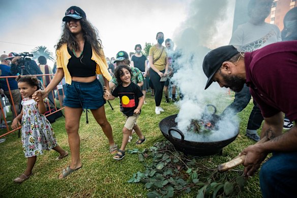 Smoking Ceremony hosted by David Tournier (right) at the We-Akon Dilinja (mourning reflection) ceremony on Australia Day in St Kilda.