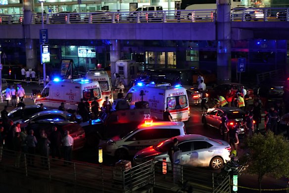 Security and ambulances block the road outside Turkey's largest airport, Istanbul Ataturk, after it was hit by a suicide bomb attack.