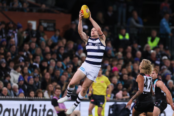 Flying high: Patrick Dangerfield battled through adversity to finish the game against the Power, before he was sent to hospital.