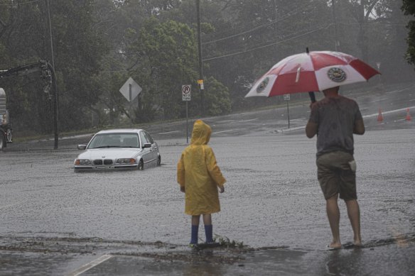 A car is seen partially submerged and abandoned in Roseville.