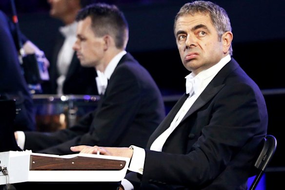 Actor Rowan Atkinson, known for his role as Mr Bean, performs during the opening ceremony.