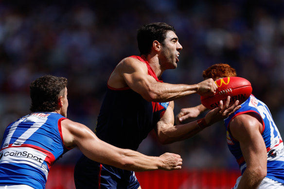 In fine touch: Christian Petracca looks to get the ball away against the Bulldogs last weekend.